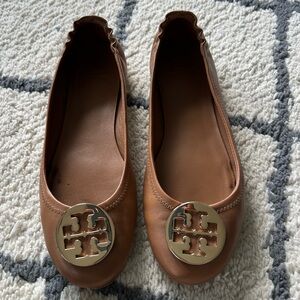 Tory Burch tan and gold flats, size 10.